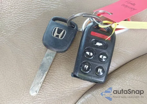 2010 Honda Odyssey Ex-L z USA, uszkodzony, nr VIN 5FNRL3H69AB058555